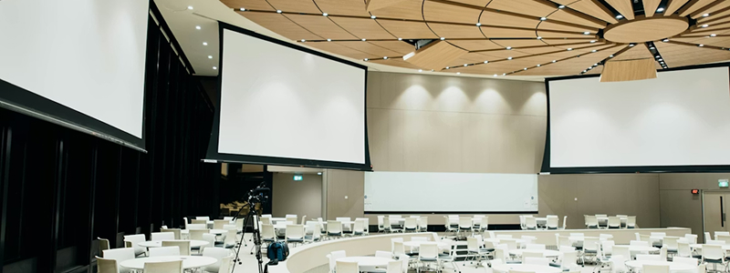 Large conference room with stage and audience